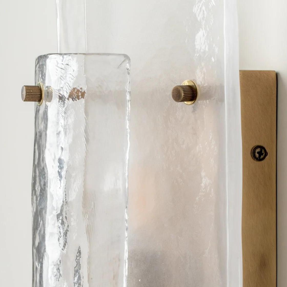 Side detail of Velora wall lamp glass shade