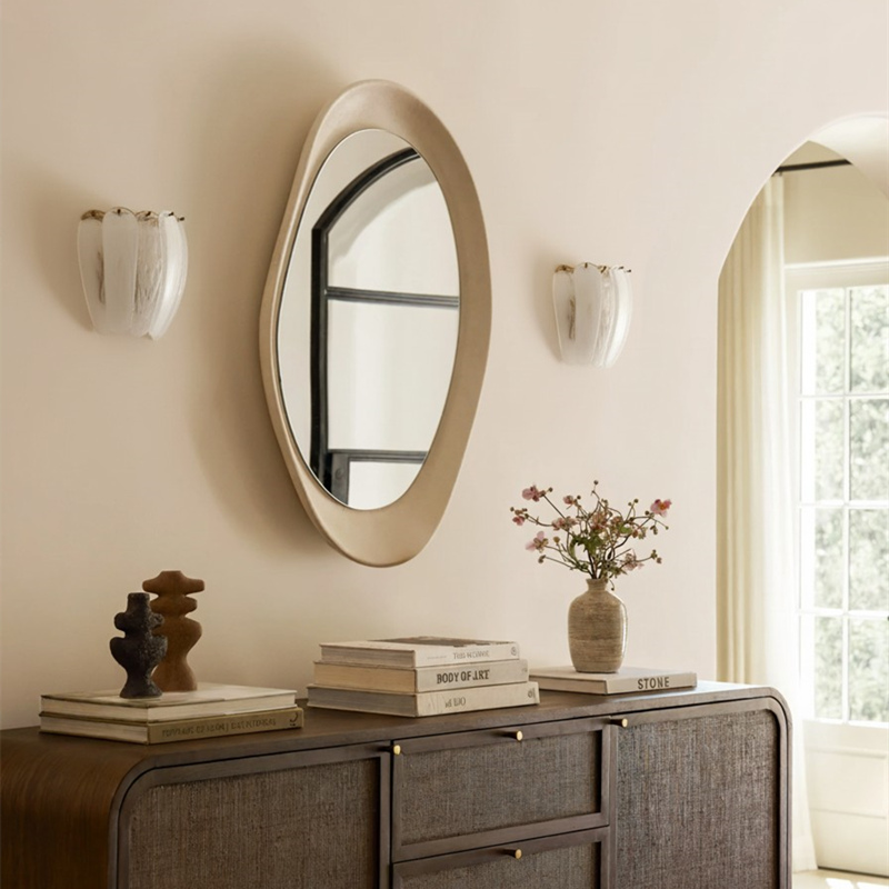 Velora wall lamps beside a round mirror
