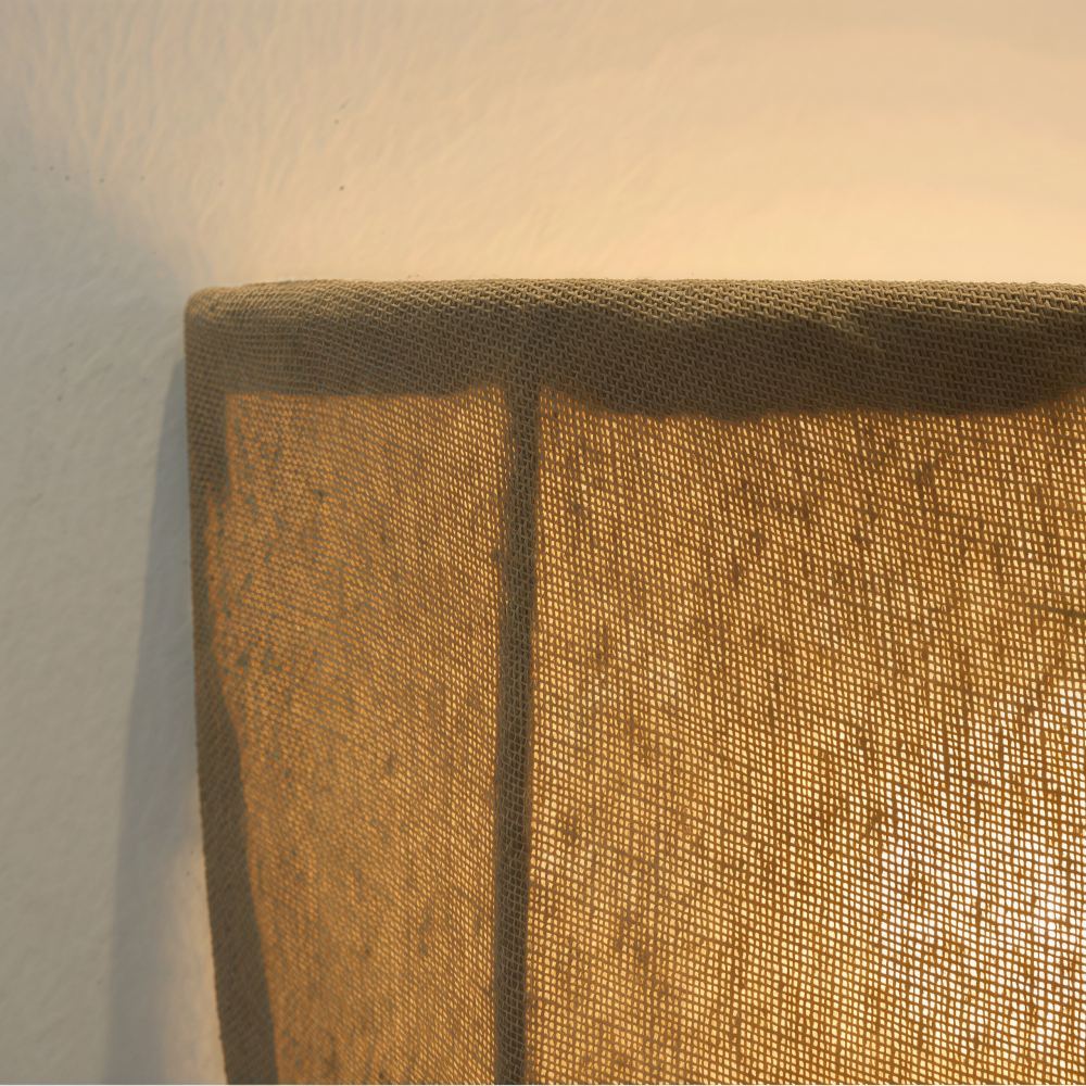 Illuminated close view of the textured fabric shade