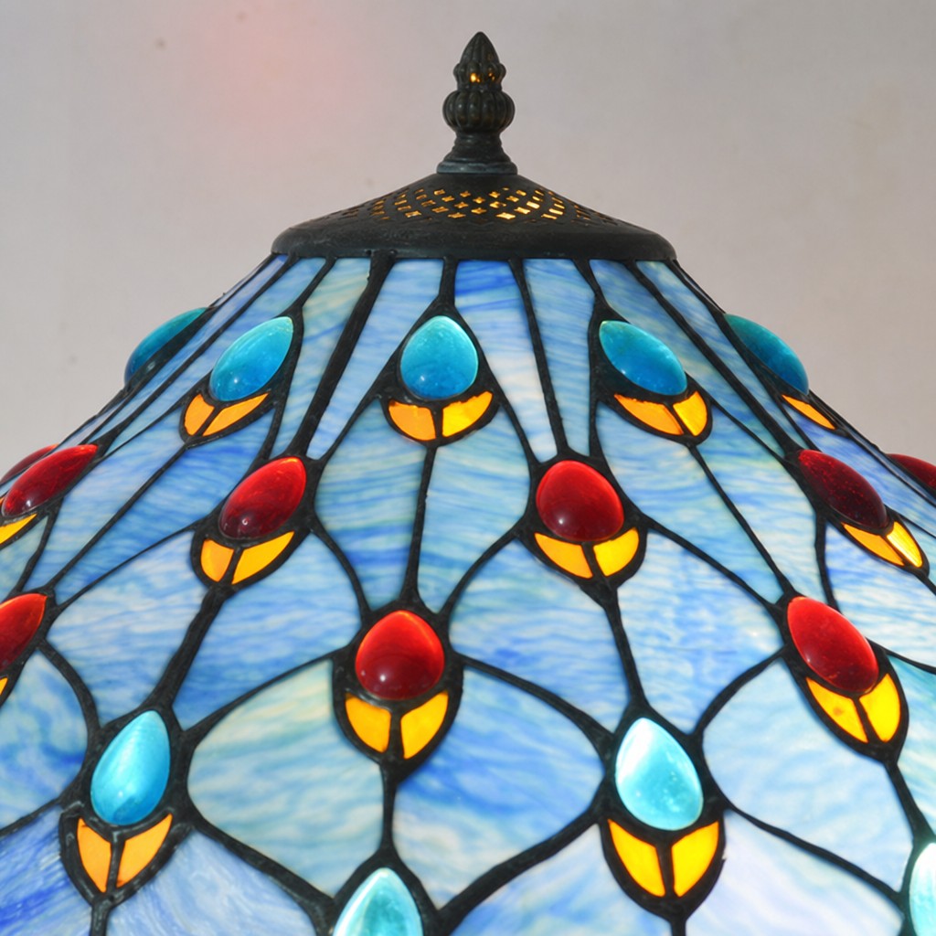 Close view of blue stained glass lamp shade pattern