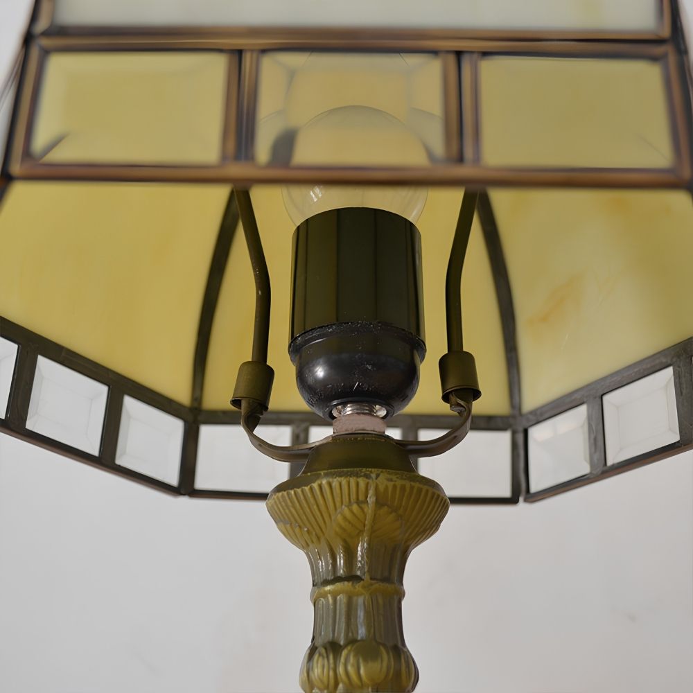 Close view of beige stained glass lamp shade and lamp holder