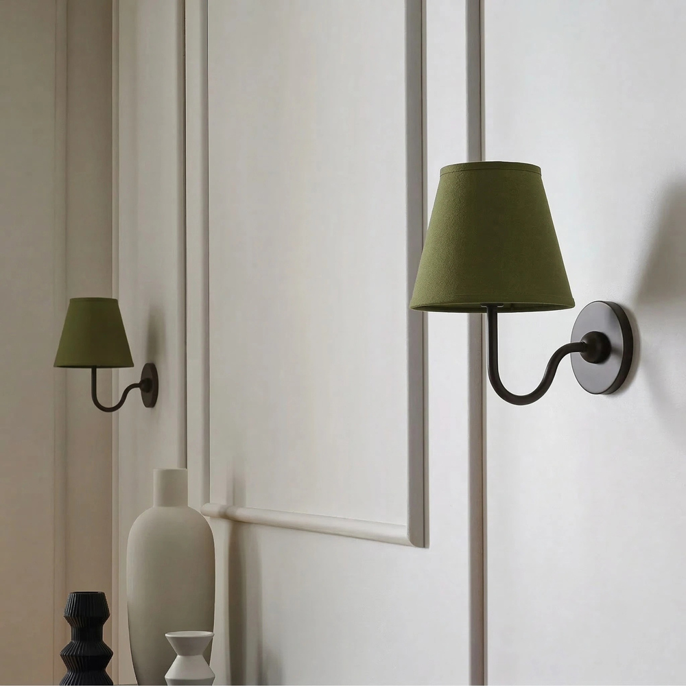 Customer room with green Luvora wall lamp shade
