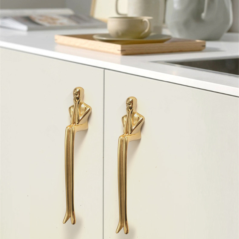 Brass Verlitho handles installed on light cabinetry