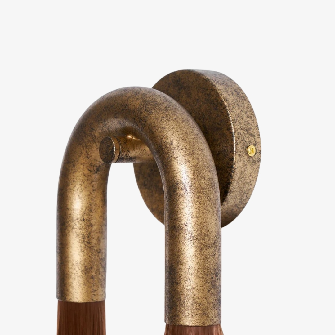 Close-up of Strandia wall sconce curved metal body