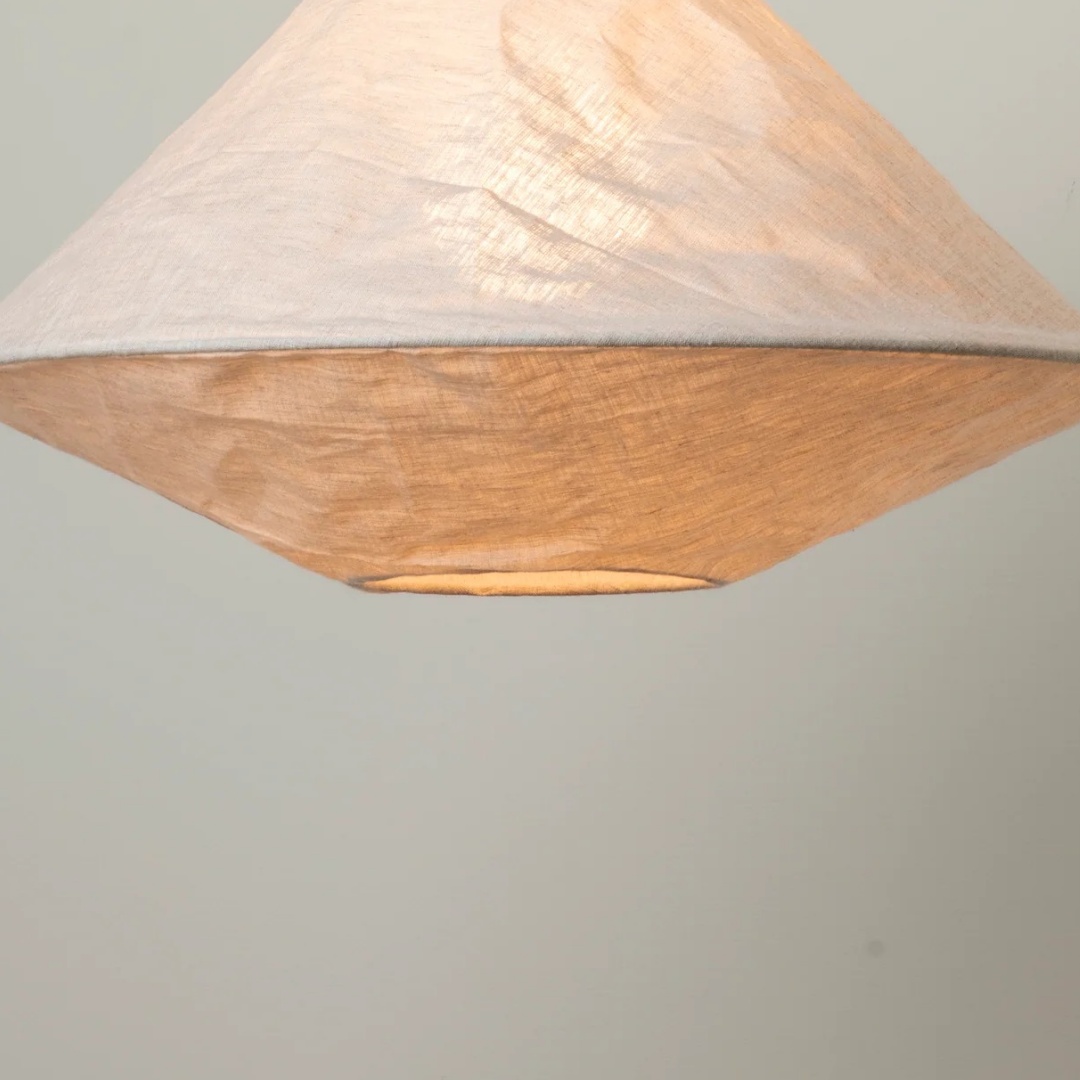 Illuminated detail of the Zalen woven pendant shade