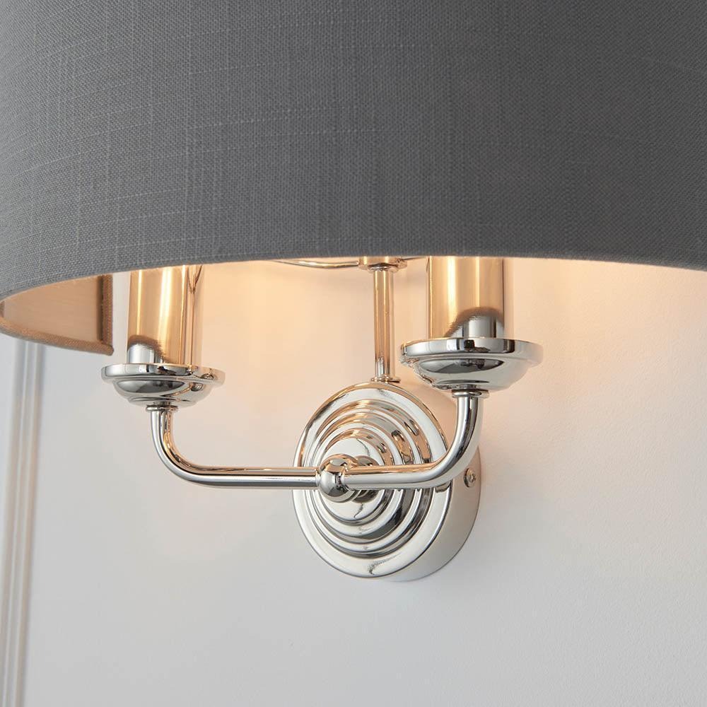 Close look at nickel Tela wall sconce with dark shade
