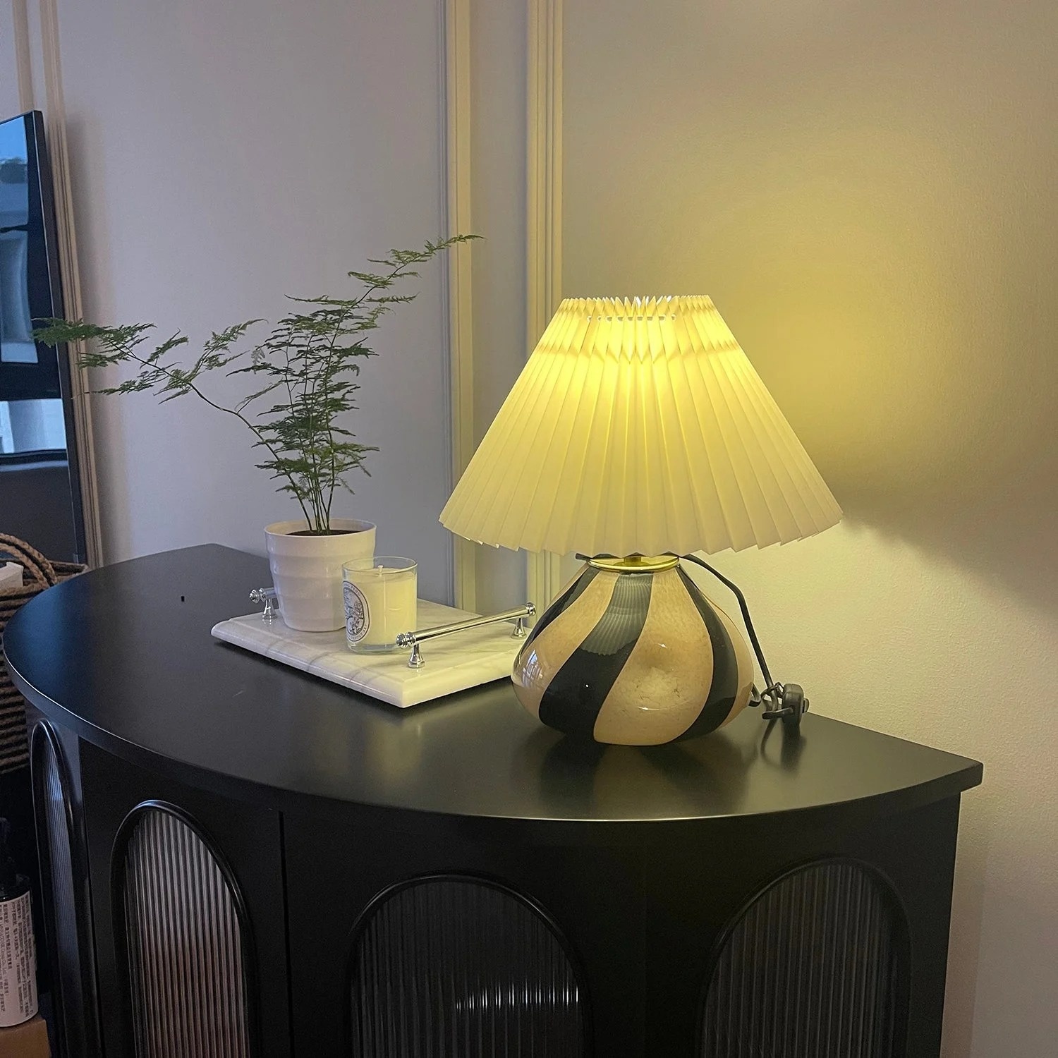 Customer nightstand photo with warm Undara table lamp
