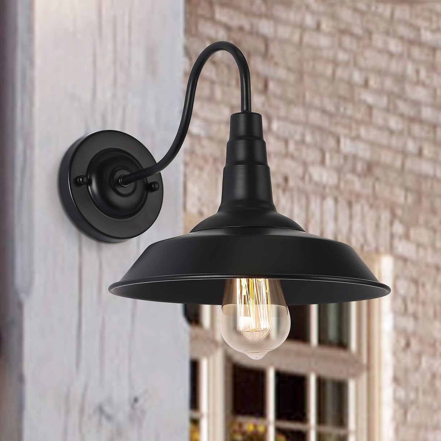 Vintage industrial outdoor wall light mounted on a brick wall