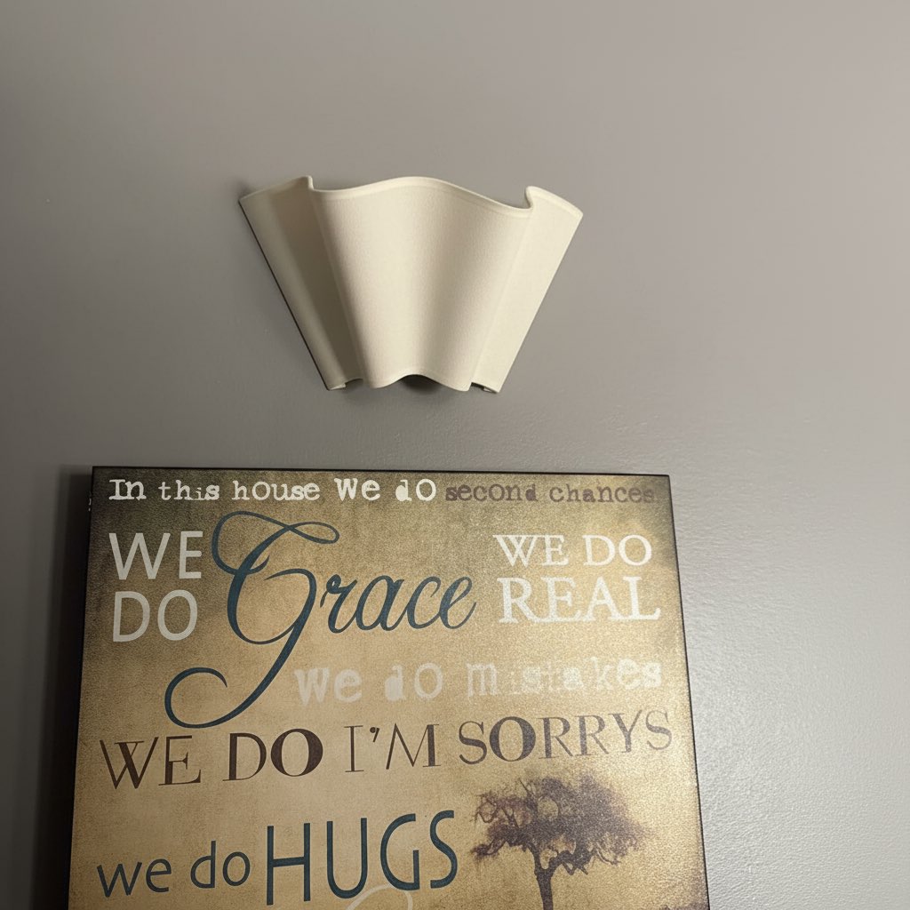 Customer photo of Oslan wall sconce above wall art