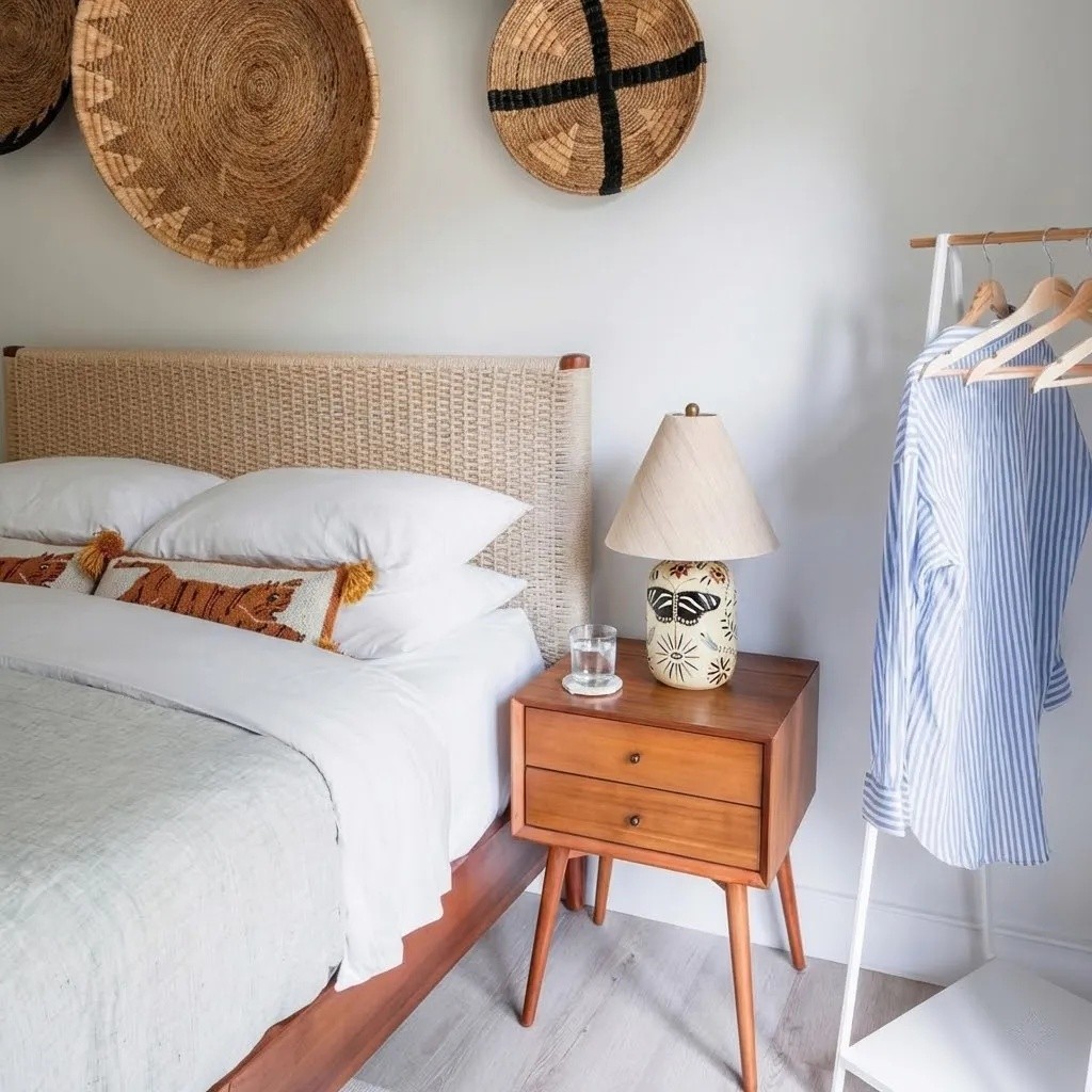 Ceruna table lamp on a bedside table in a light bedroom