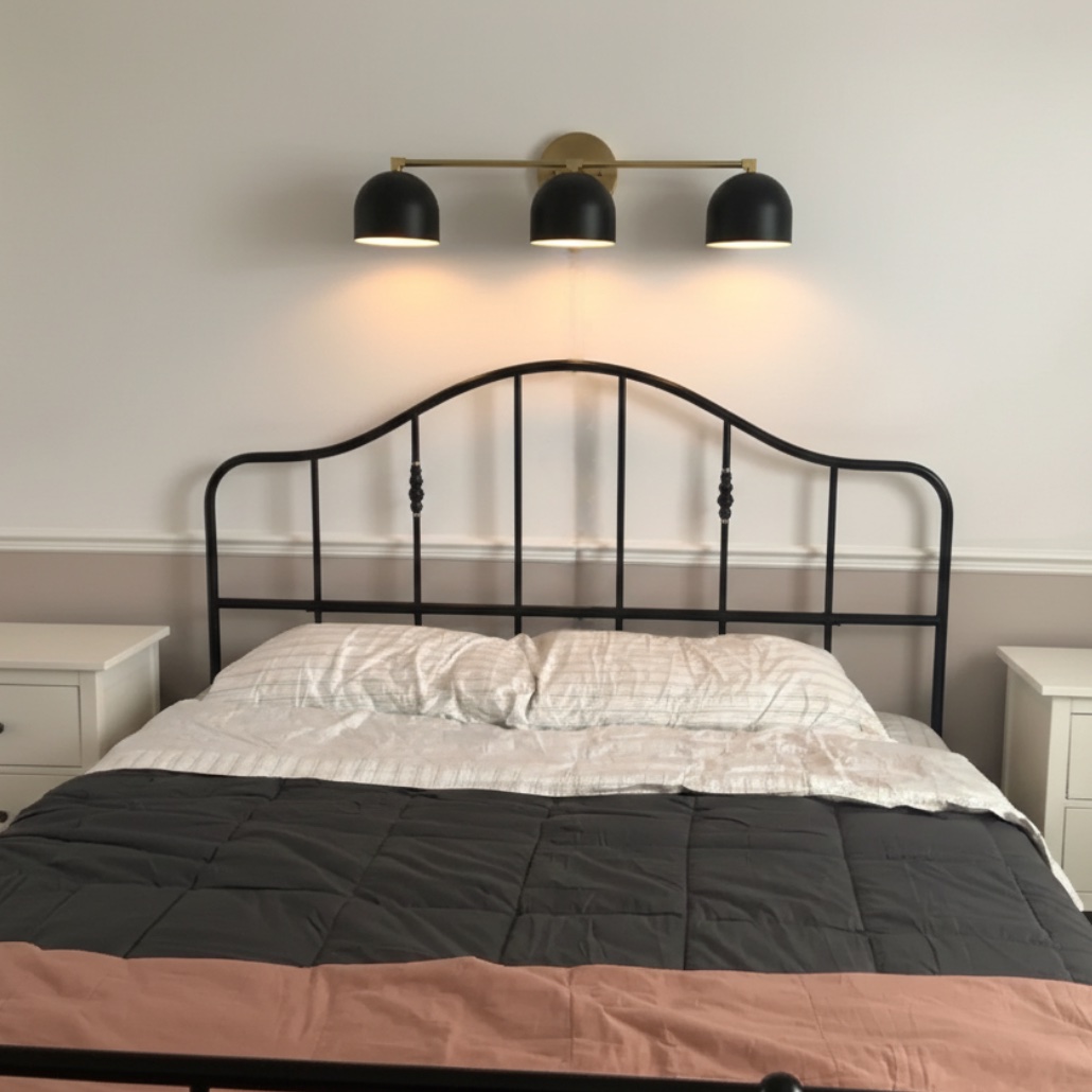 Customer bed wall with Metio vanity lamp