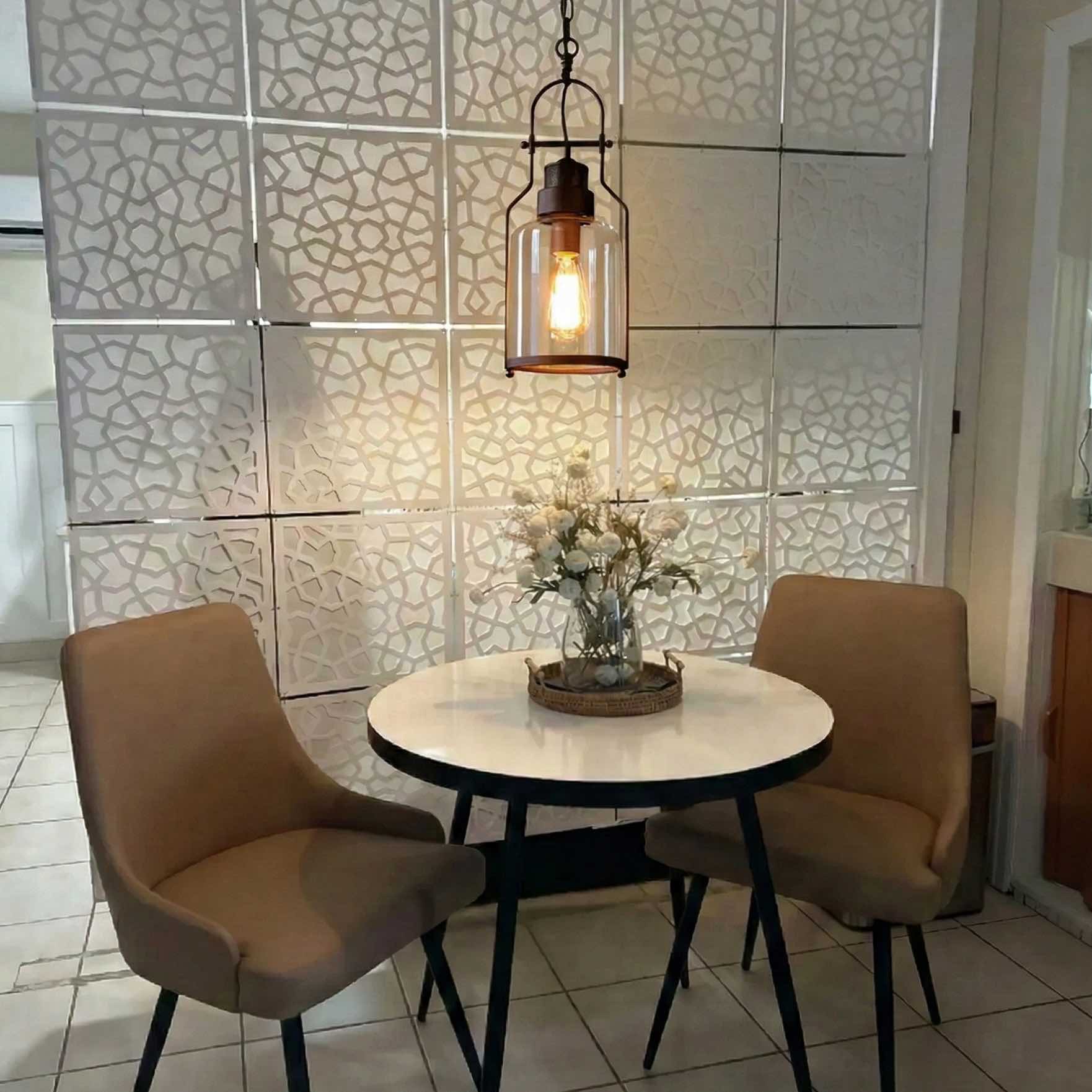 Customer photo of Lirra pendant light above a small table