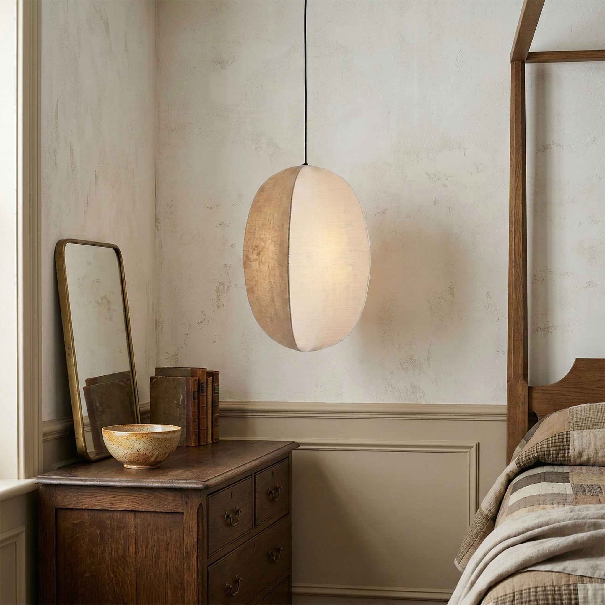 Single Diora pendant beside a mirror