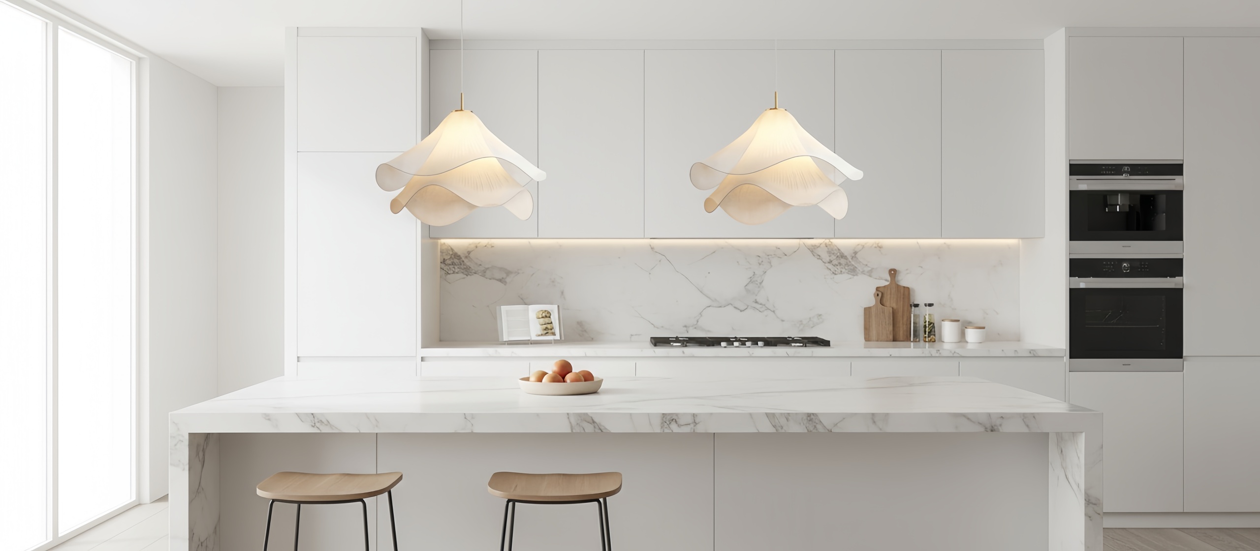 Two floral pendant lights above a kitchen island