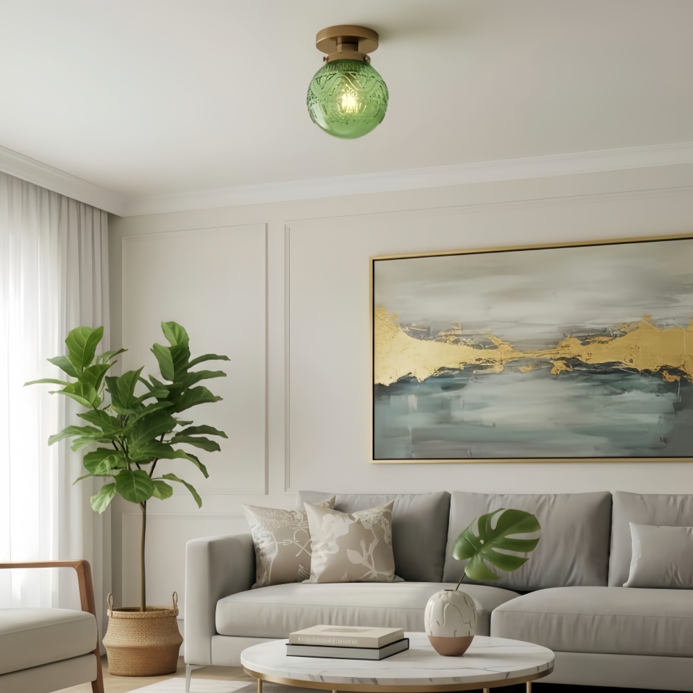 Naveliro-Deckenleuchte aus grünem Glas in einem Wohnzimmer