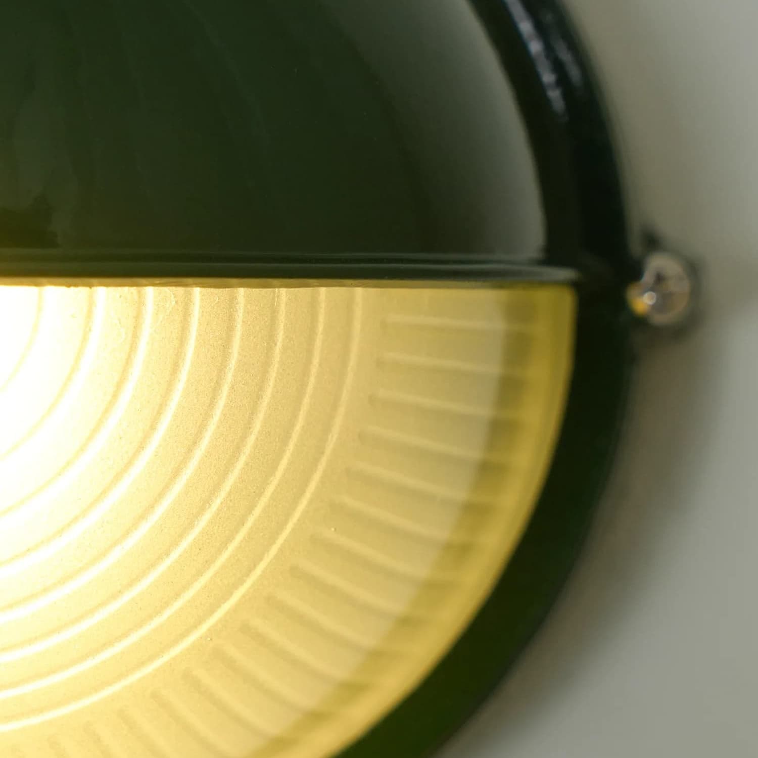 Close-up of the green Docka glass shade while lit