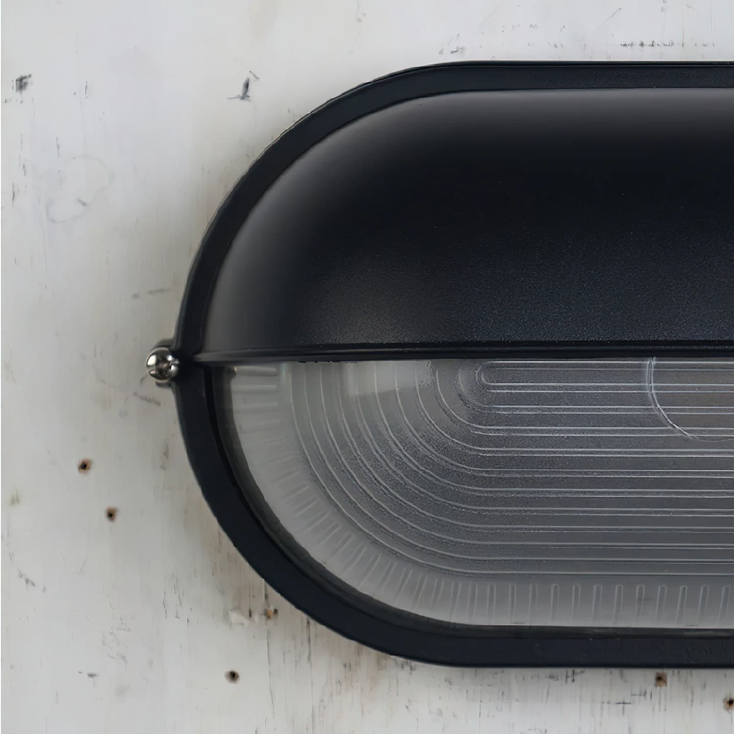Close-up of the black Docka lamp housing and glass diffuser