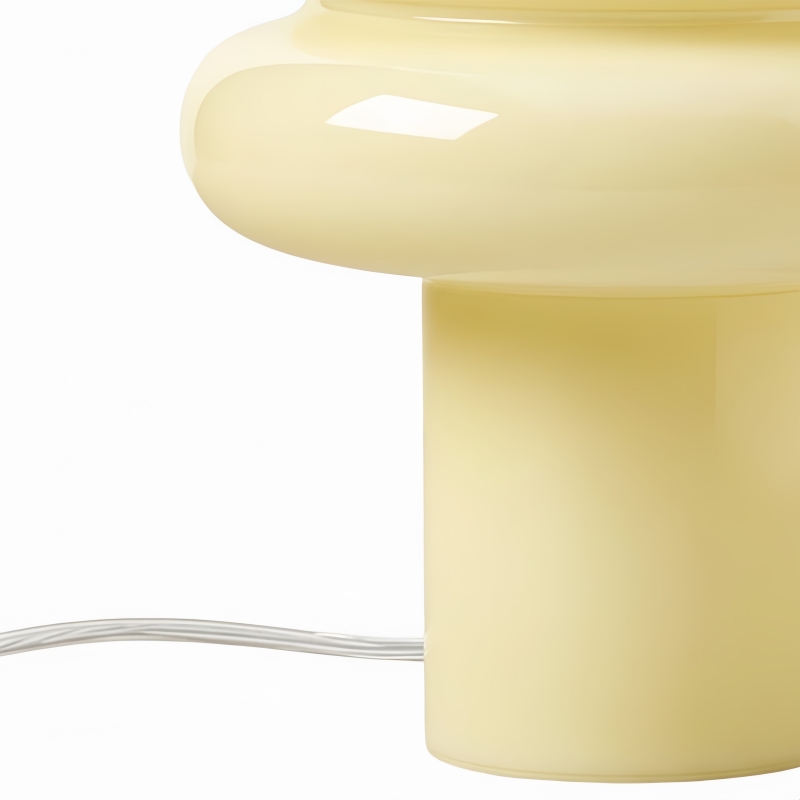 Close-up of yellow opal glass lamp with textile cable
