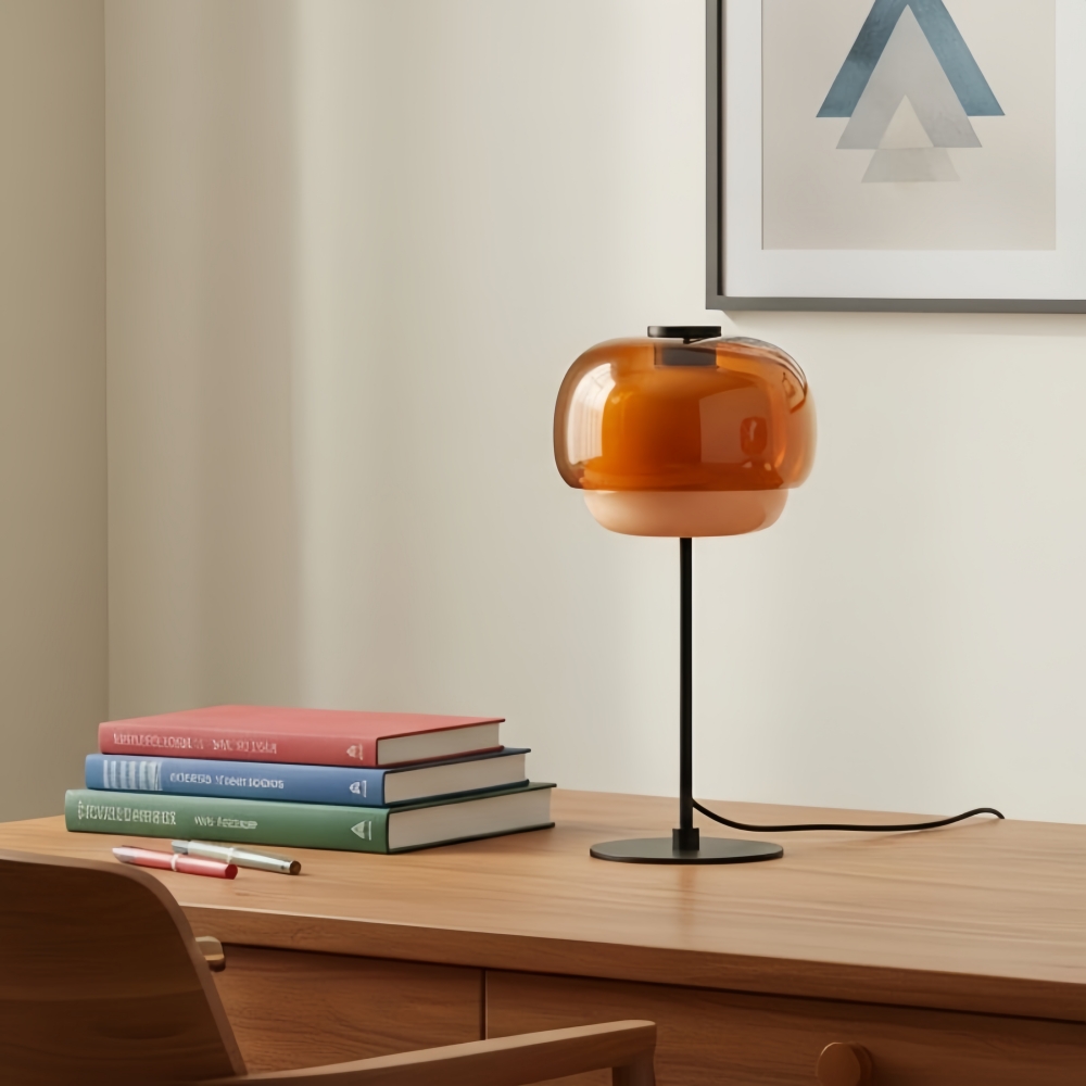 Clinco table lamp on a desk with books