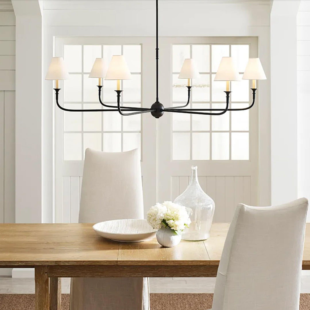 Piaf Grande chandelier above a dining table