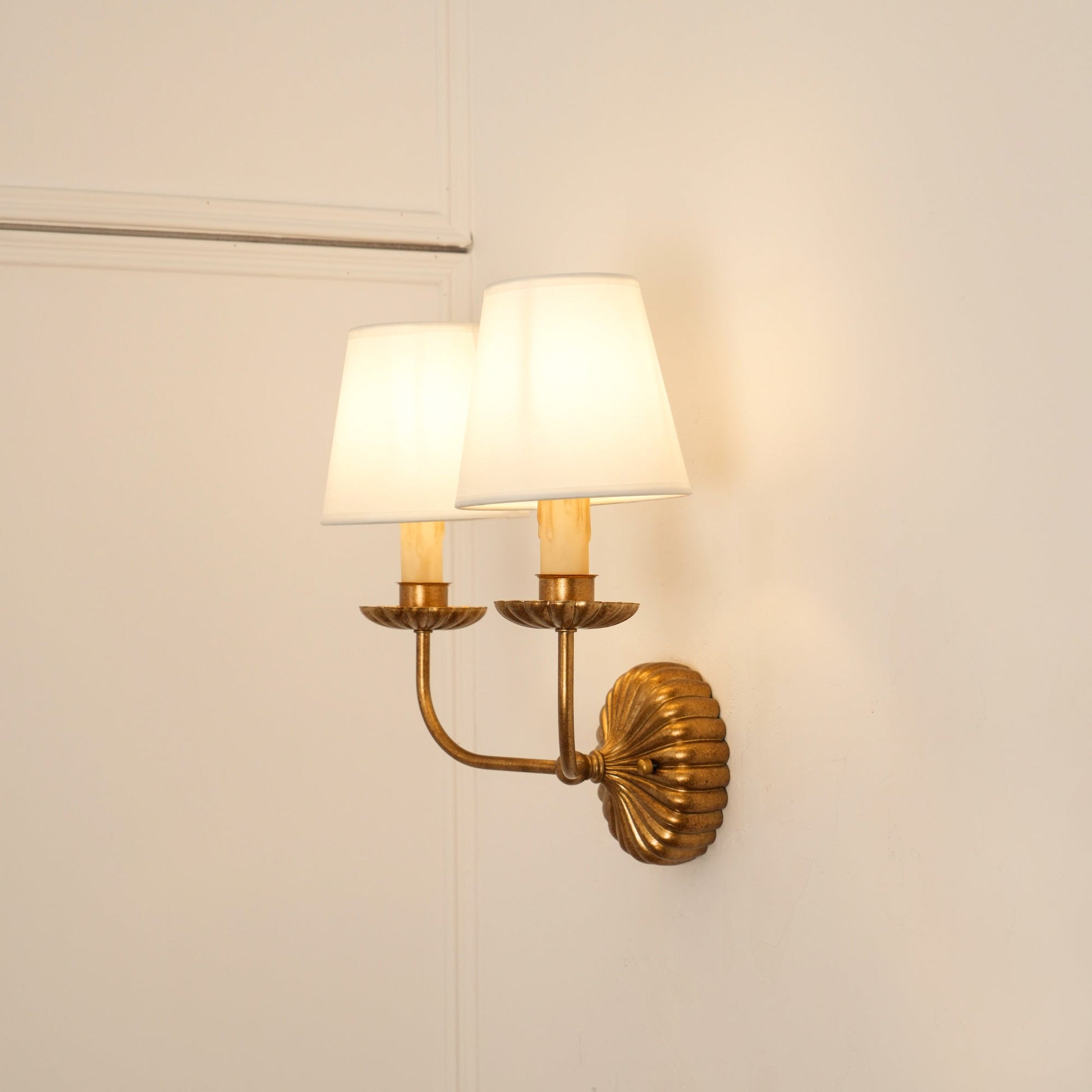 Double Catina wall sconce in antique gold finish