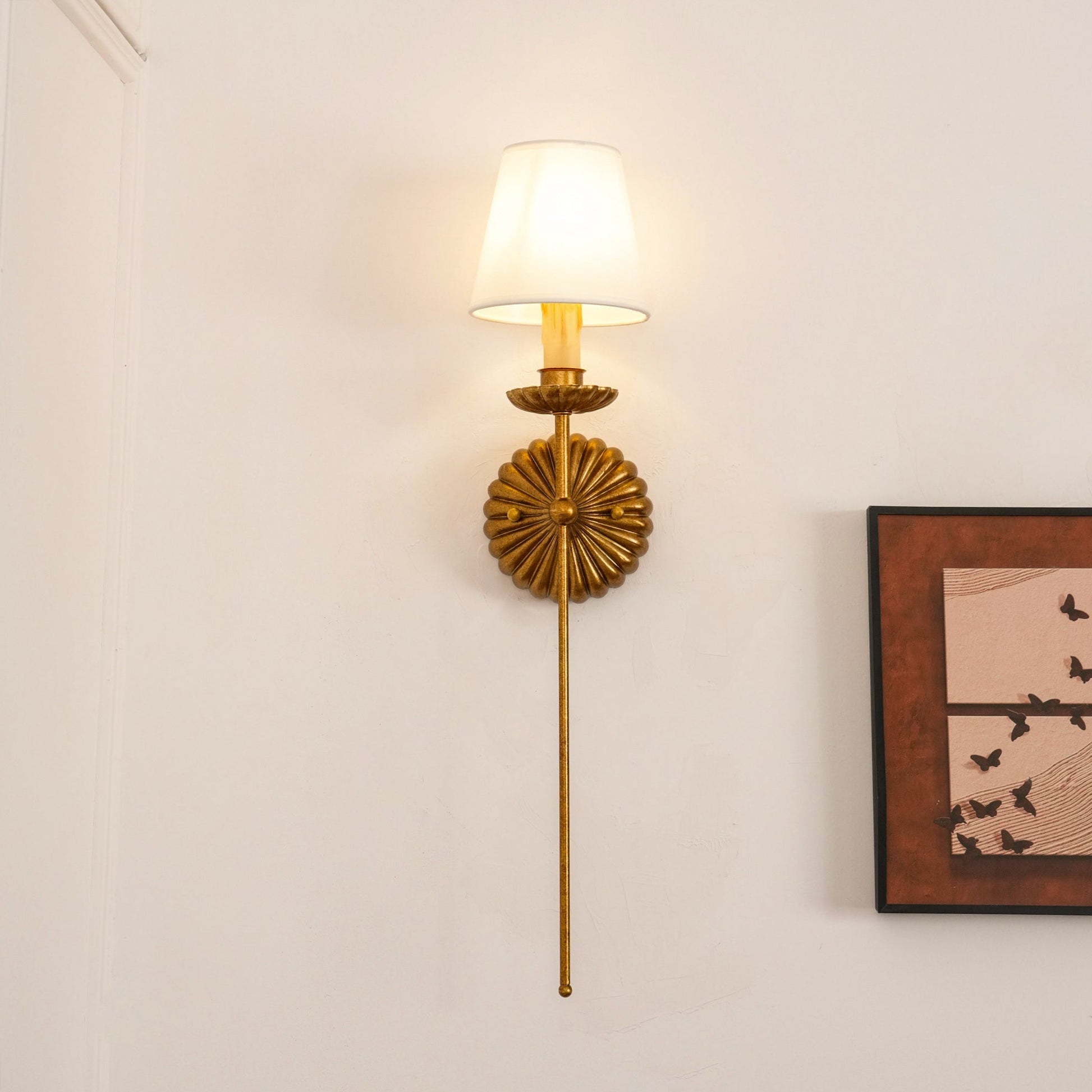 Catina wall sconce with framed wall art