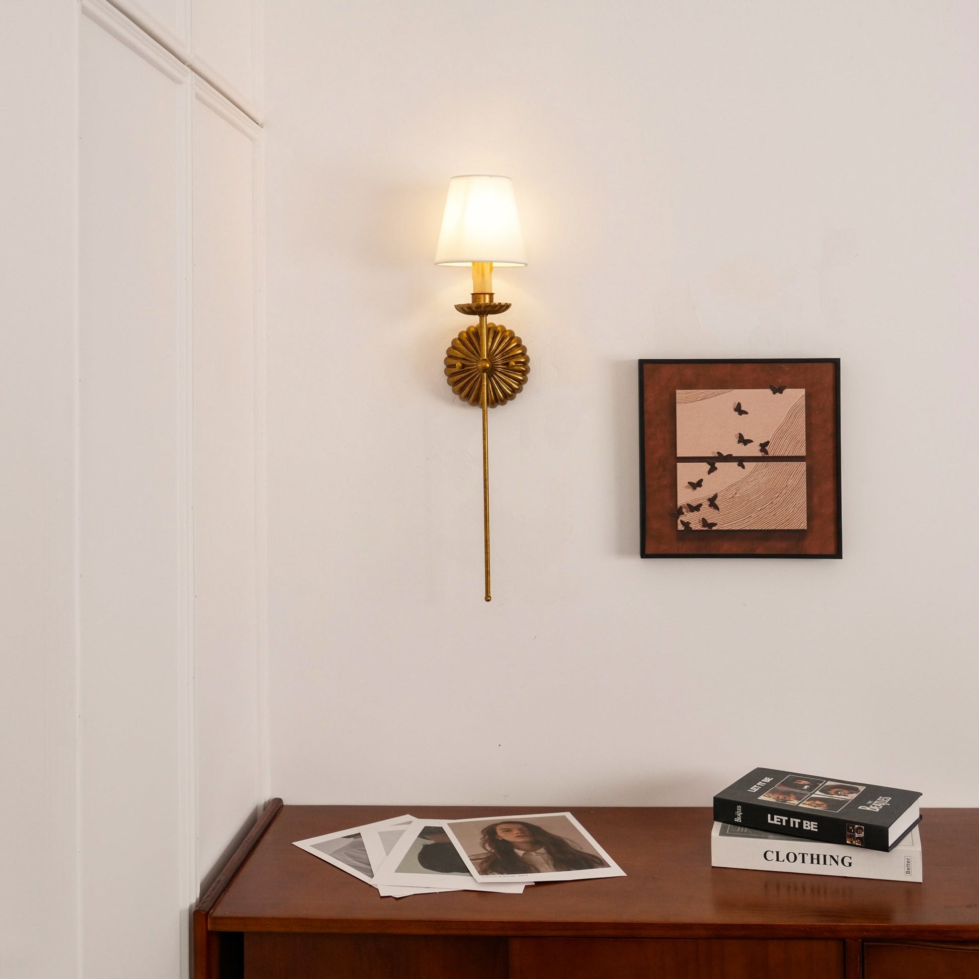 Catina wall lamp styled above a console table