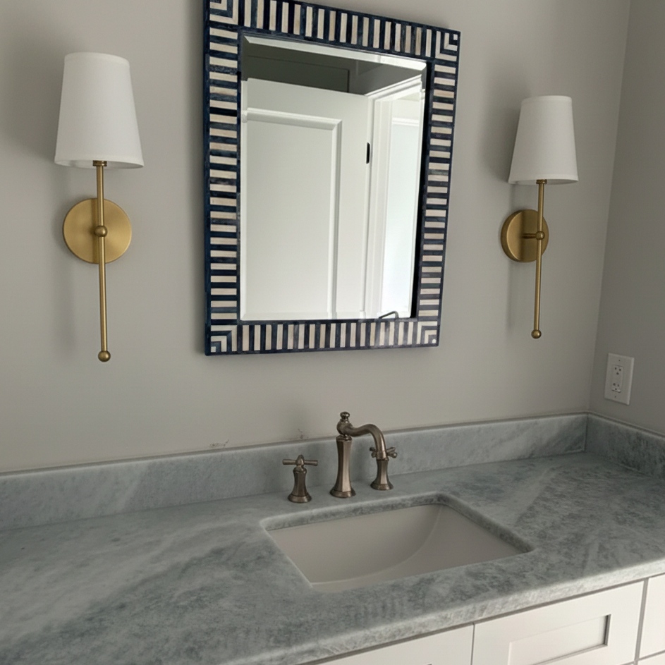 Meshara wall lamps beside a bathroom mirror