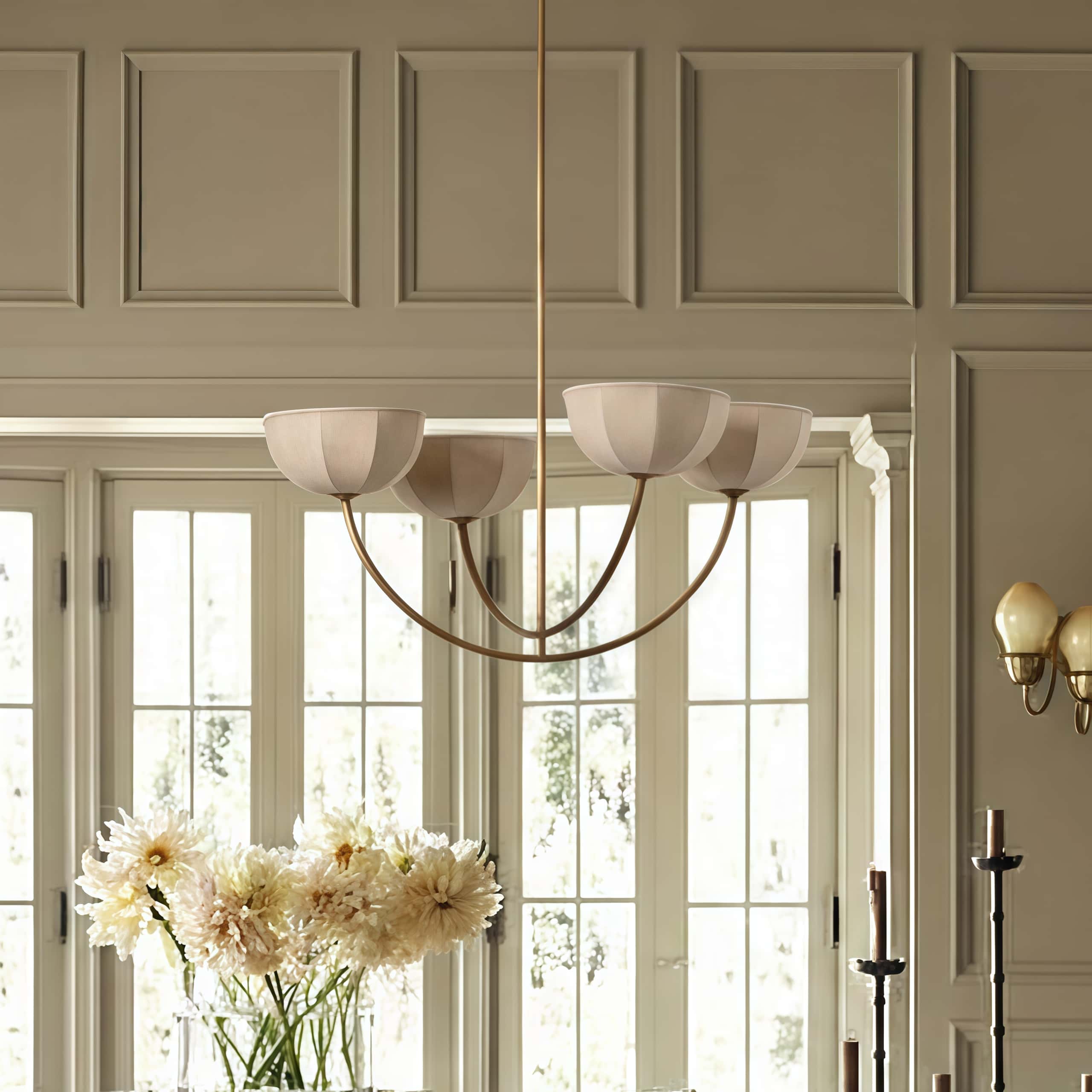 Customer room with Loomis chandelier near tall windows