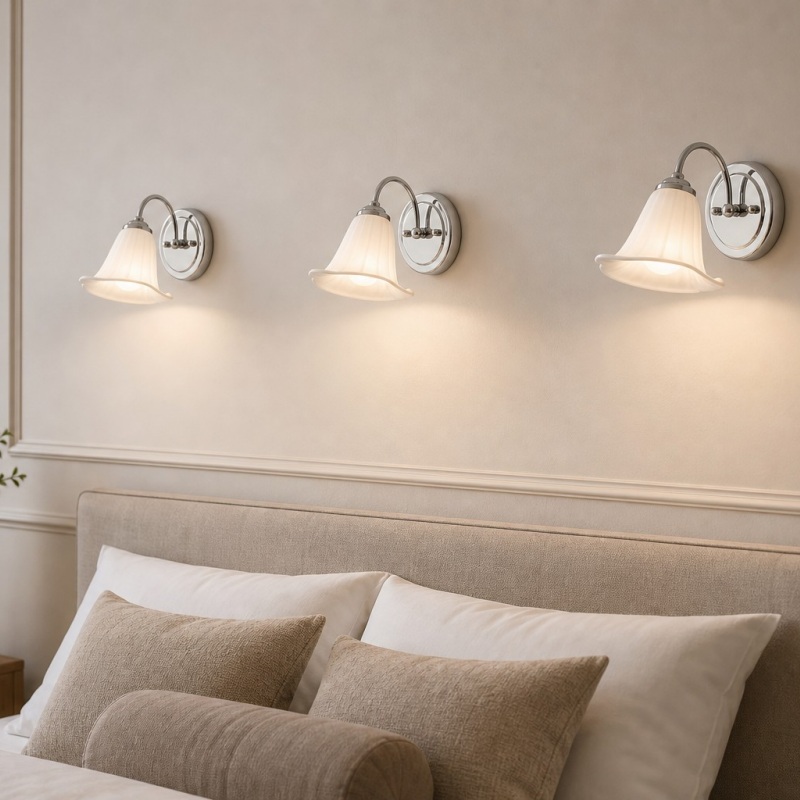 Celvane wall lamps above a bed