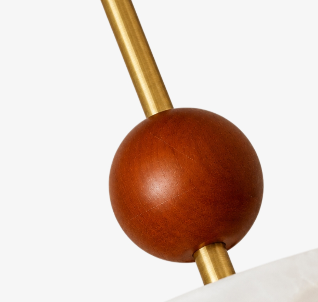Close-up of wooden accent and brass stem detail