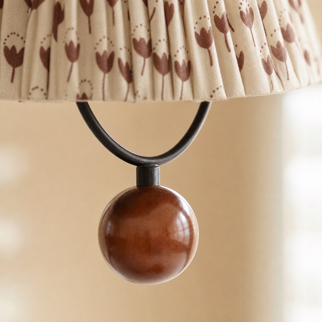 Close view of the fabric shade and wooden accent ball