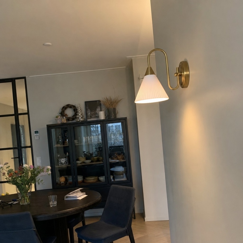 Customer room photo with lit wall lamp
