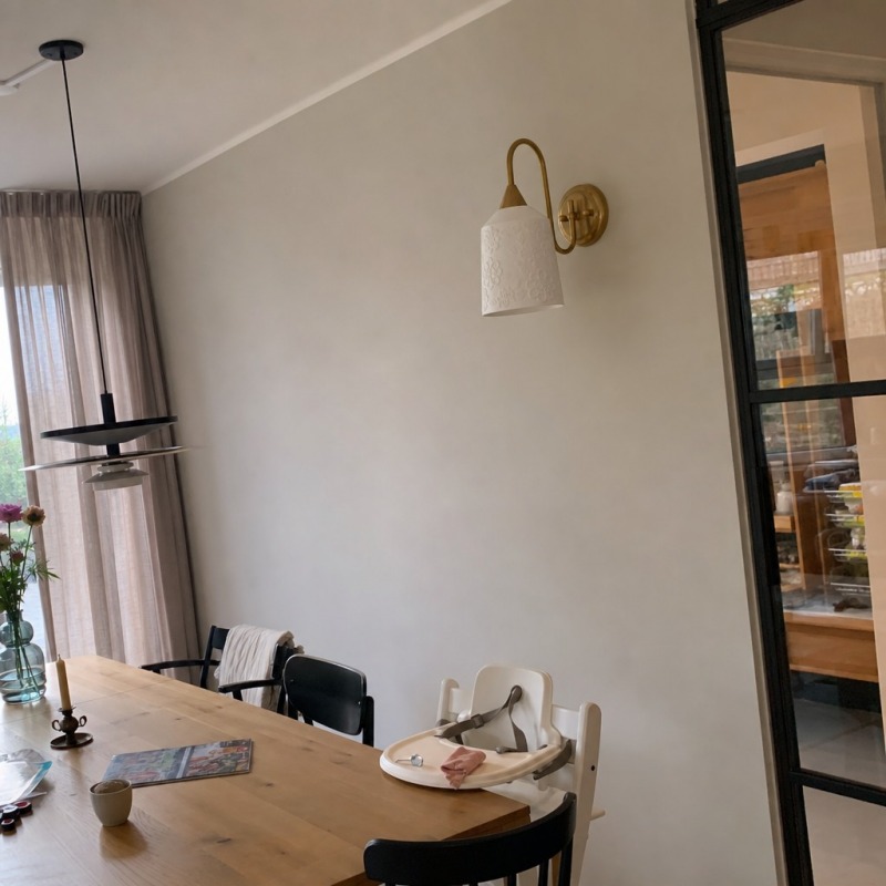 Customer dining room photo with wall lamp