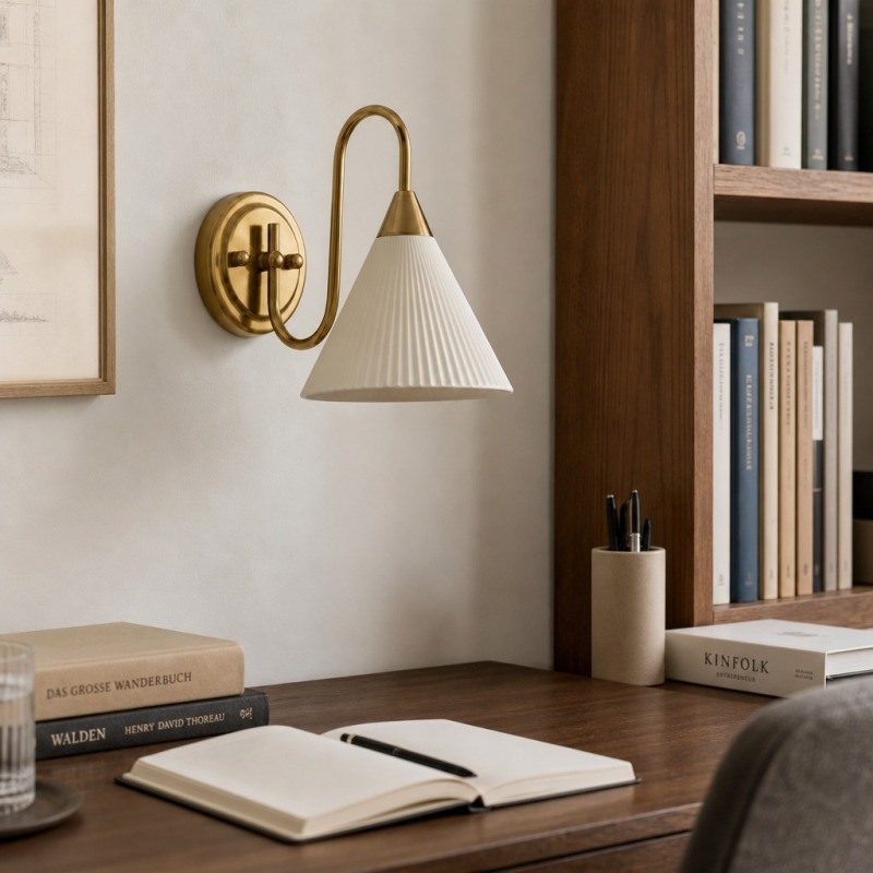 French vintage wall lamp beside a desk