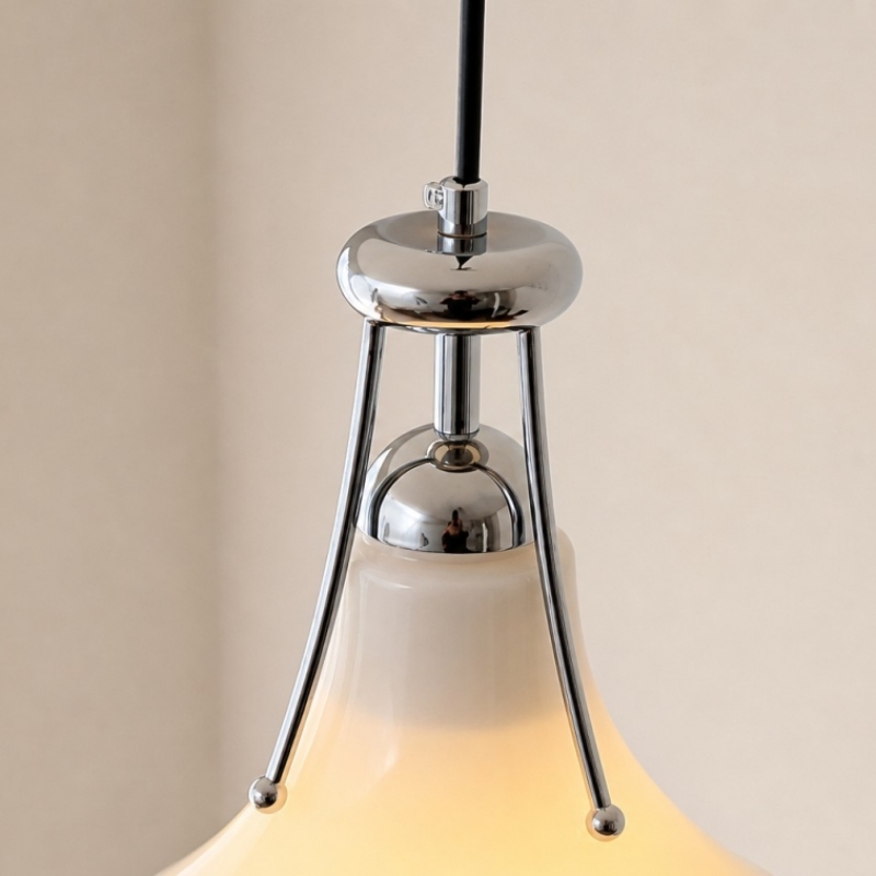 Close-up of pendant cord and chrome lamp holder