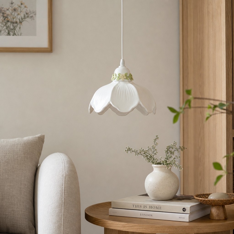 White flower pendant lamp above a side table