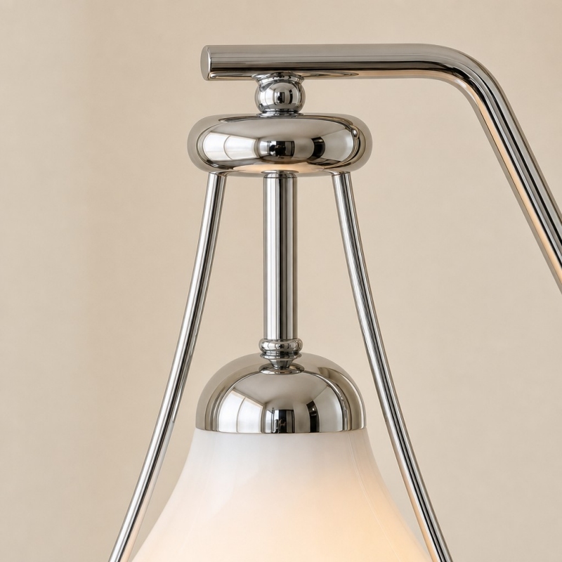 Close-up of the polished metal lamp frame