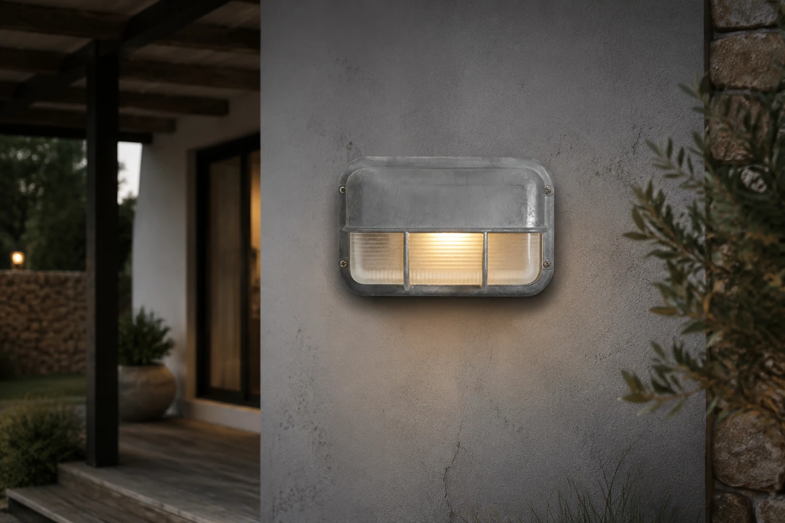 Morvane industrial outdoor sconce shown in a lifestyle exterior scene