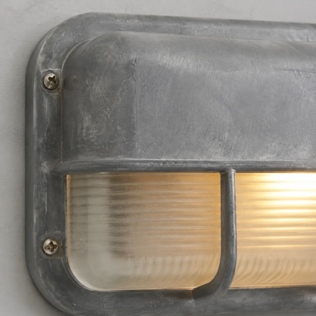 Close-up detail of Morvane industrial metal wall light material and finish