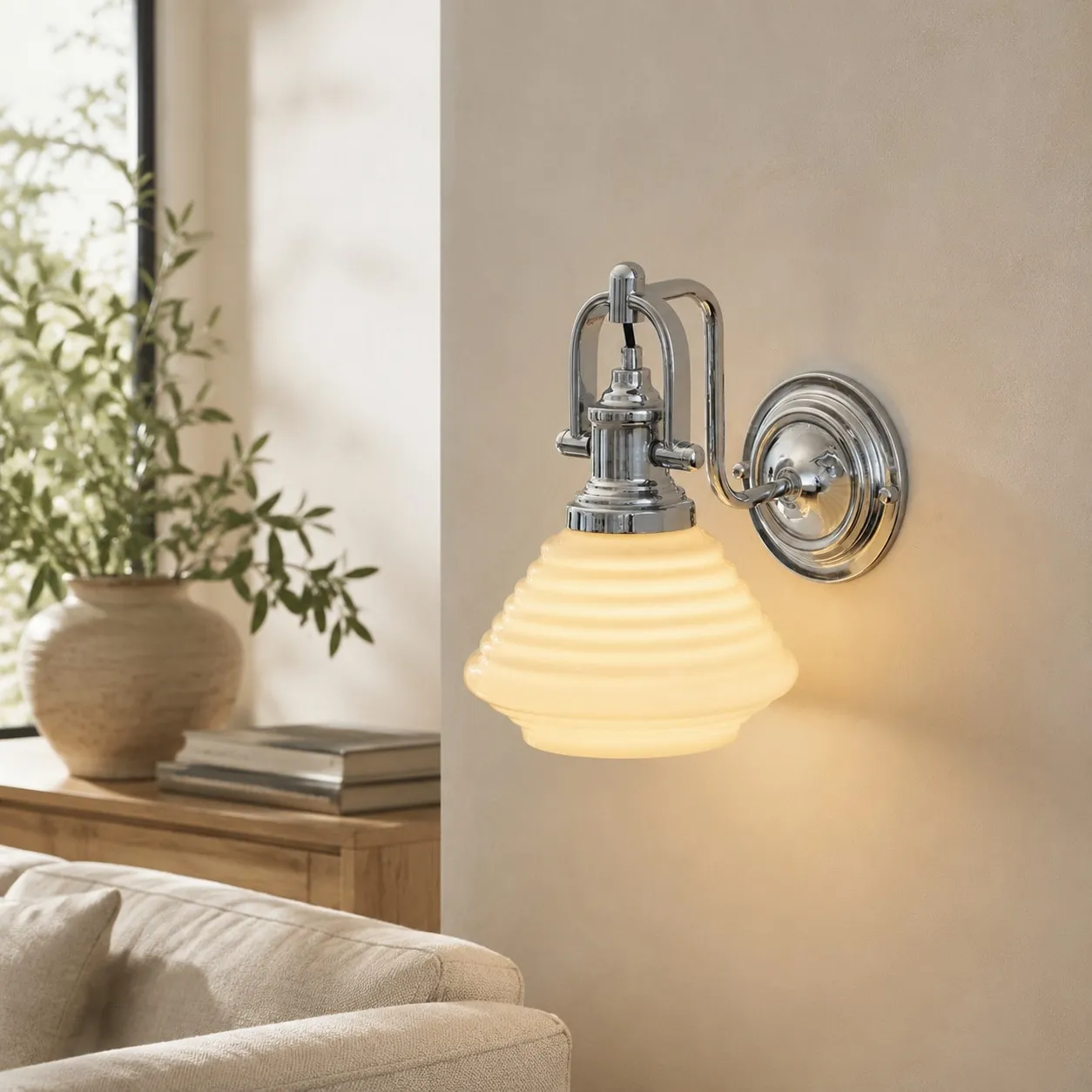 Creamy yellow glass wall sconce in sunlit lounge setting